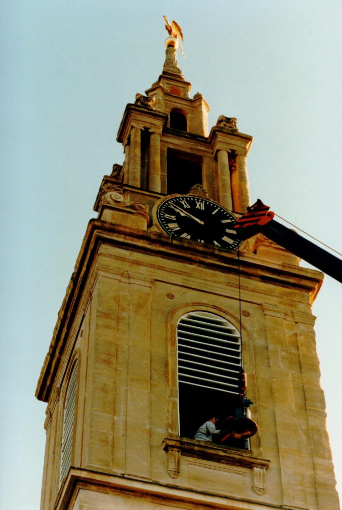 The last of the bells is craned into the tower